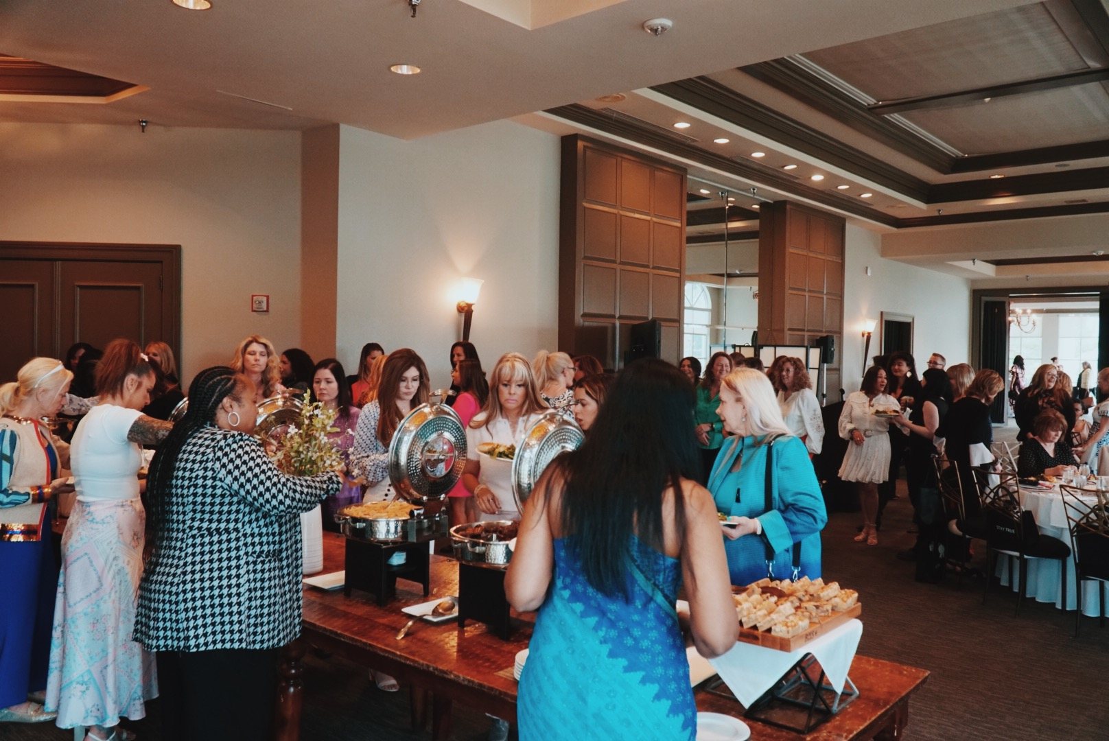 Women gathered in the OWN IT event room