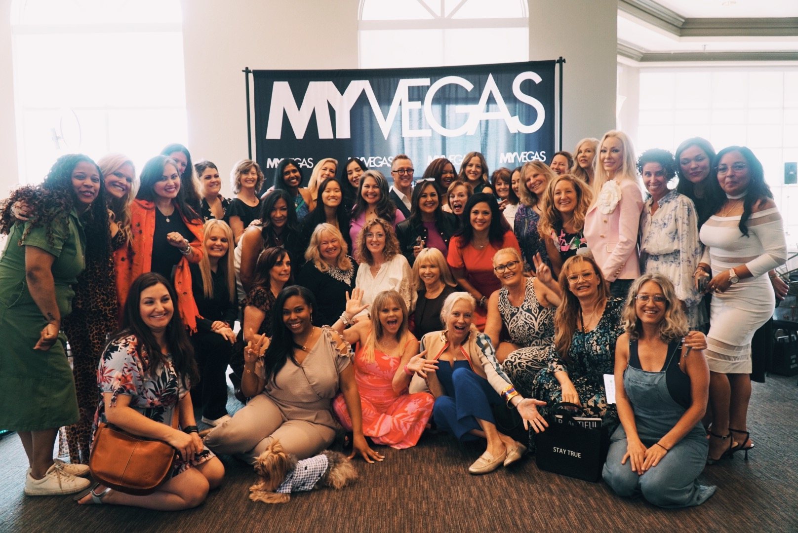 A large group of women gathered at an OWN IT event